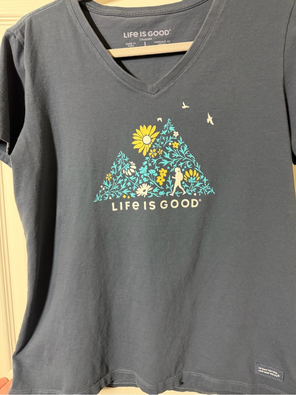 Life is Good Women’s Navy V-Neck Tee with Floral Triangle Graphic
